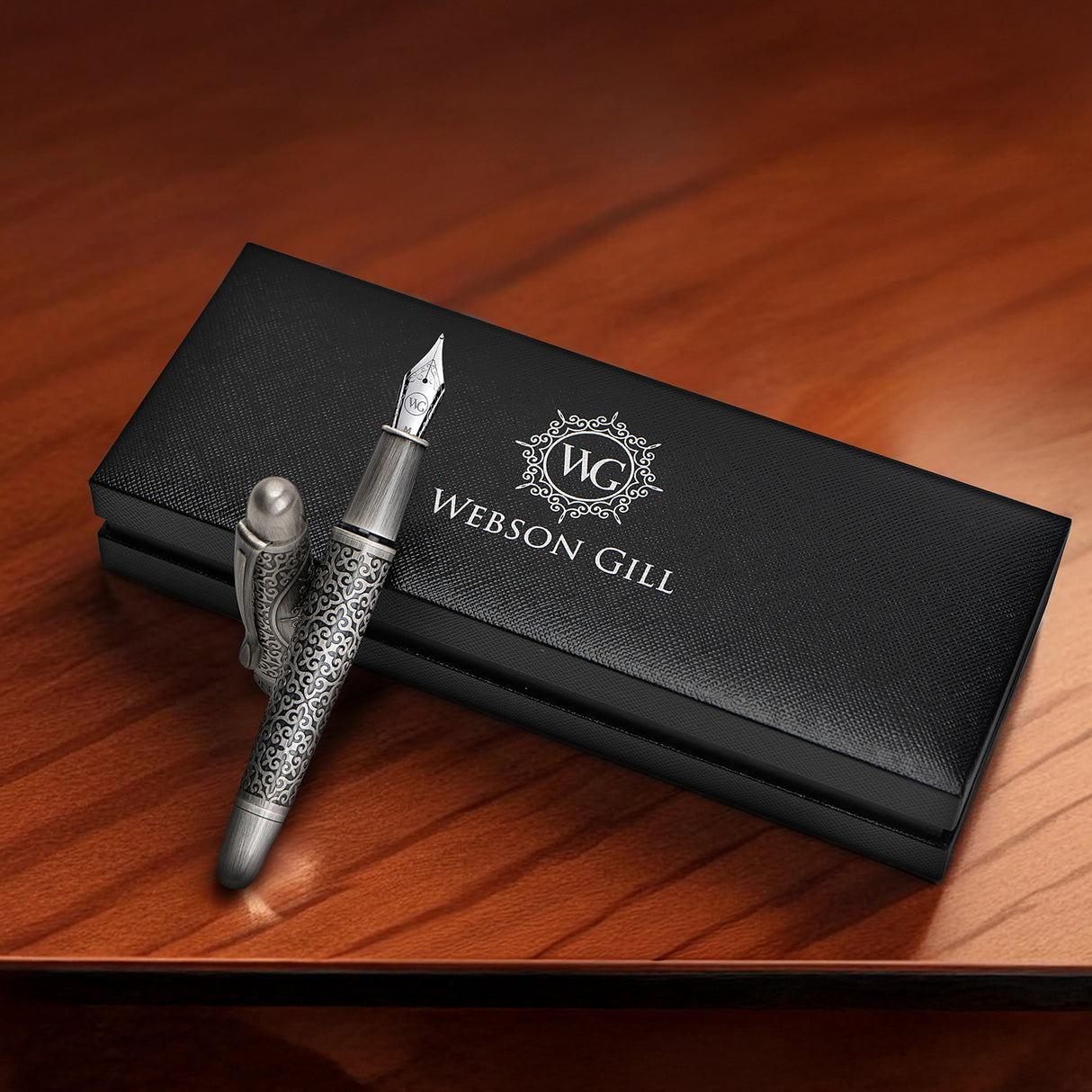 The 'Admiral' Premium Fountain Pen by Webson Gill rests on a sleek black Webson Gill gift box atop a polished wooden surface.
