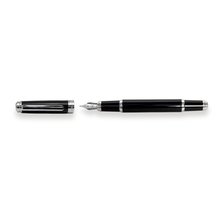 The Mogul Fountain Pen by Webson Gill, featuring a black body with silver accents and a stainless steel medium nib, lies next to its uncapped lid on a white background.