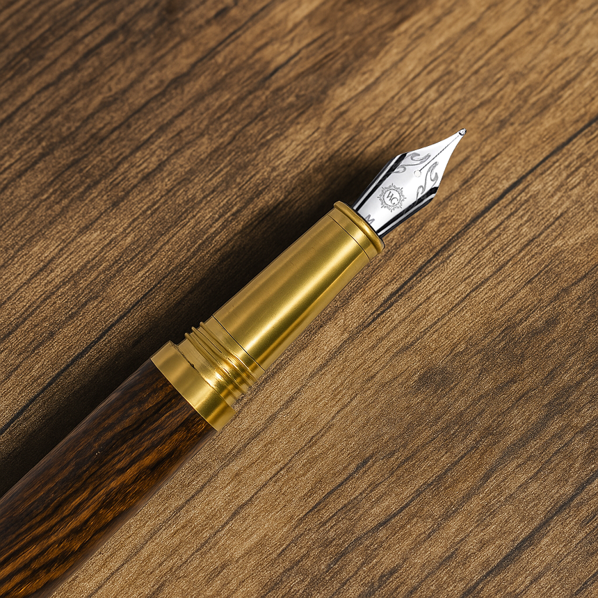 The Webson Gill 'Captain Edition' Premium Fountain Pen—crafted from oak wood with gold accents—rests elegantly on a wooden surface, showcasing its luxury design.