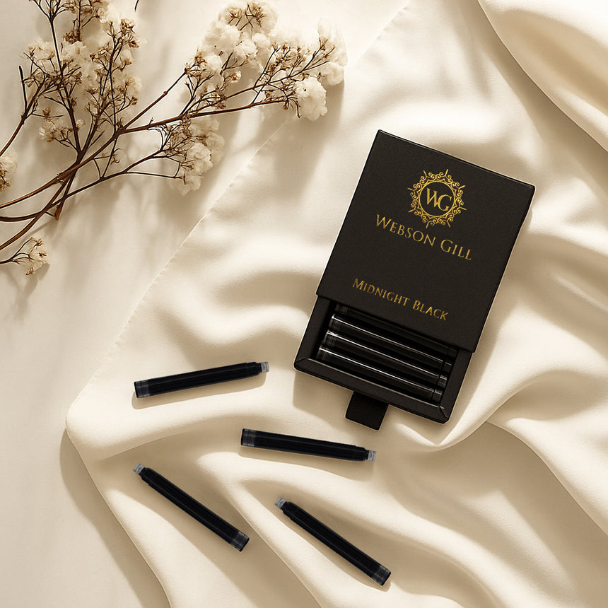 The Webson Gill Ink Refill Cartridge—Instant Insert for Webson Gill Fountain Pens in black ink—rests on cream fabric beside dried flowers, offering smudge-free performance for fountain pen enthusiasts.