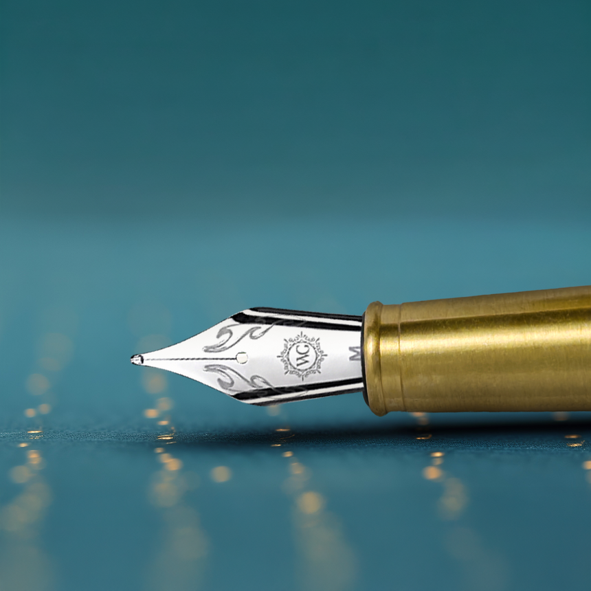 A close-up of the Webson Gill 'Captain Edition' Premium Fountain Pen—crafted from oak wood with a detailed silver nib—resting on a blue surface.