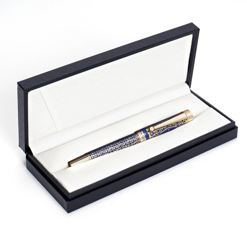 The Regal Premium Fountain Pen by Webson Gill features gold brass filigree and blue accents, presented in a black-and-white case—an ideal choice for fountain pen collectors.