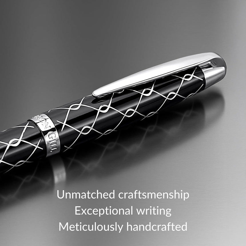 WG’s ‘The Weaver’ Everyday Fountain Pen features a black silver lattice design, stainless steel medium nib and clip, and is crafted for a smooth writing experience. Shown resting on gray, with text highlighting its craftsmanship below.