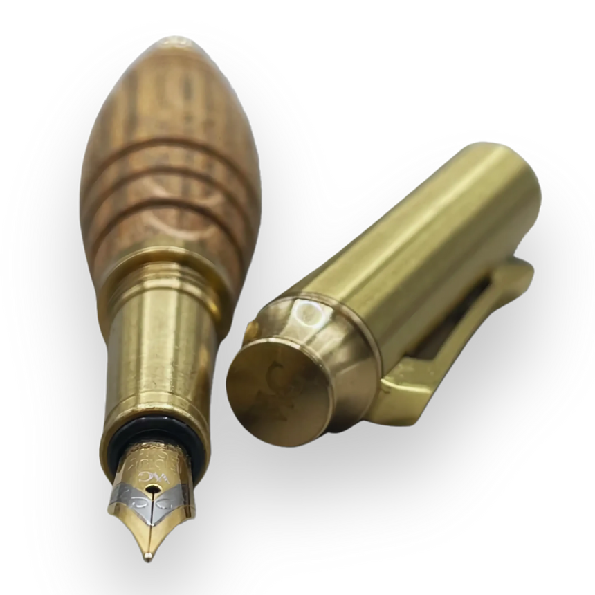 The Webson Gill 'Bourbon Barrel' Premium Fountain Pen, featuring a gold finish and reclaimed oak wooden barrel, is shown with its matching cap on a white background.