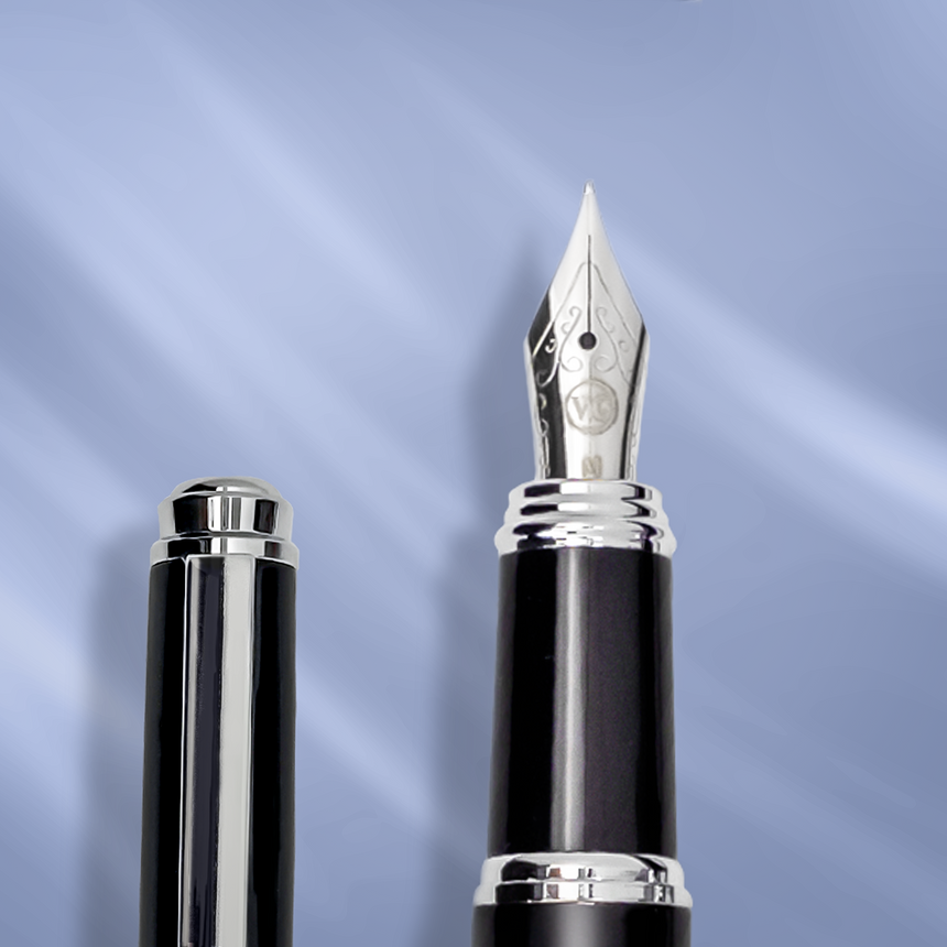 A close-up of 'The Mogul' Premium Fountain Pen by Webson Gill, showcasing its sleek stainless steel nib.