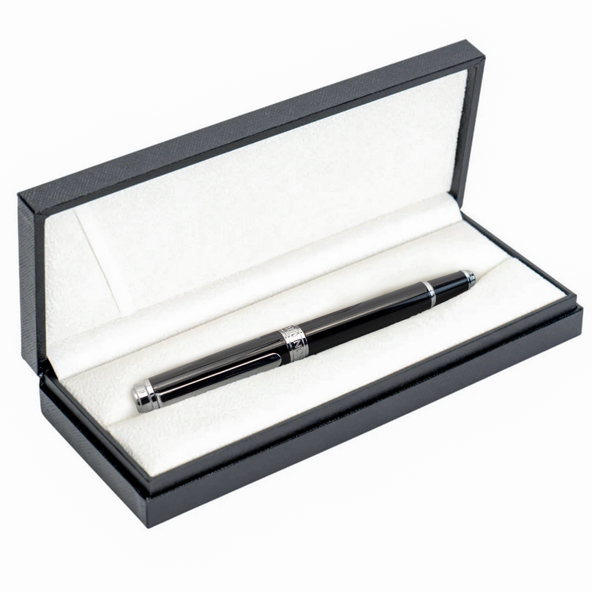 The Mogul Premium Fountain Pen by Webson Gill features silver accents and a stainless steel nib, elegantly presented in an open white and black display box.