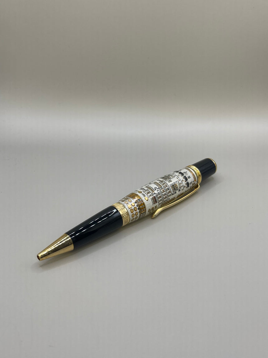 The Webson Gill "Techno Fusion" ballpoint pen from Webson Gill Archives features black and gold with silver and gold detailing, showcasing modern sophistication against a plain light background.