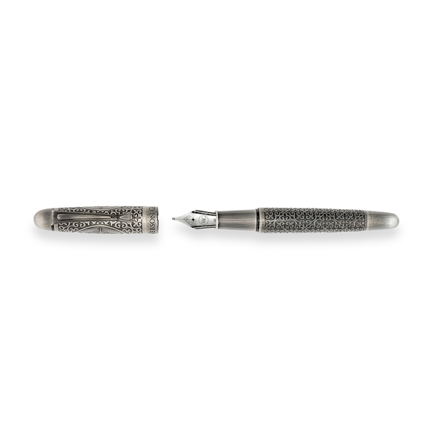 The Webson Gill Admiral Fountain Pen is a luxury writing instrument in antique silver, featuring ornate engravings and displayed with its cap removed.