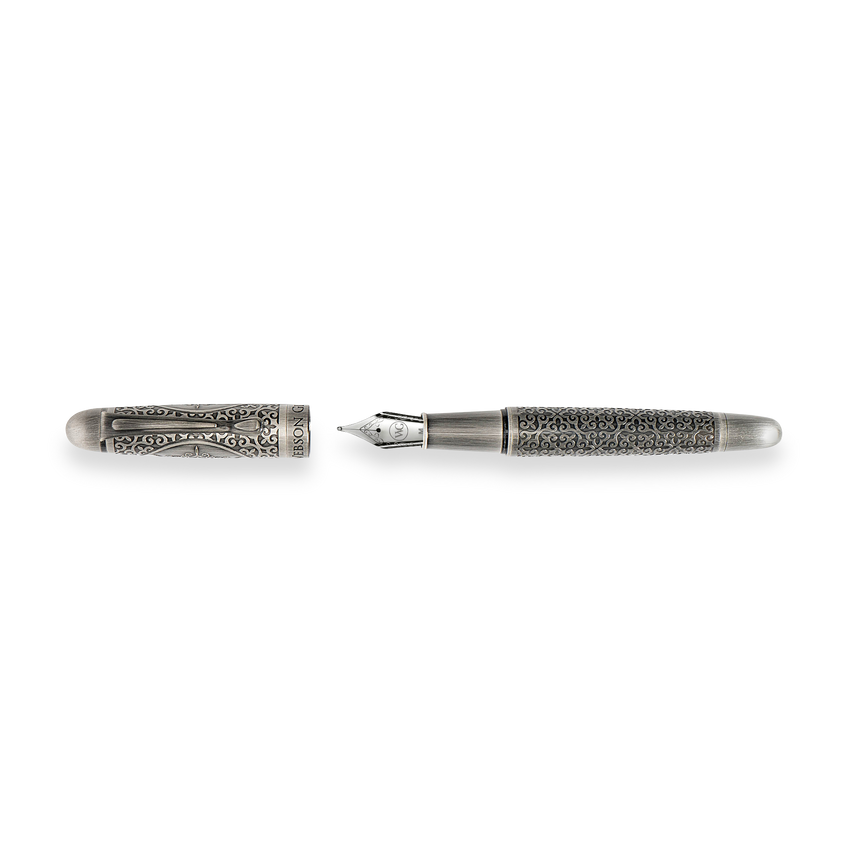 The Webson Gill Admiral Fountain Pen is a luxury writing instrument in antique silver, featuring ornate engravings and displayed with its cap removed.