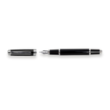 The Mogul Fountain Pen by Webson Gill, featuring a black body with silver accents and a stainless steel medium nib, lies next to its uncapped lid on a white background.