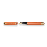 The Muse Fountain Pen by Webson Gill features a vibrant orange body, a gold-plated nib, and a matching gold-trimmed cap, all elegantly displayed on a white background.