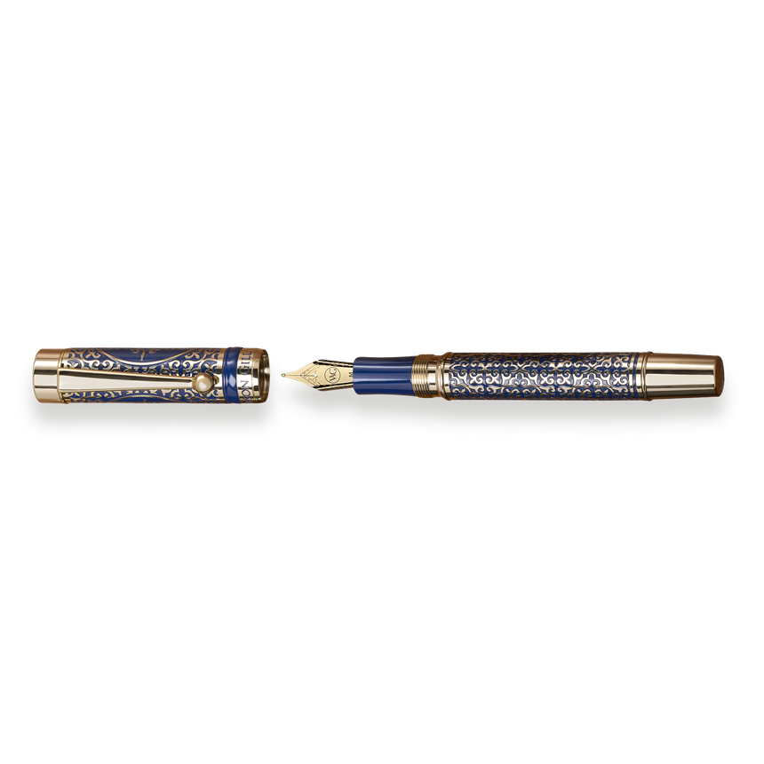 The Regal Fountain Pen by Webson Gill features an ornate blue and gold brass filigree design and is shown uncapped—a luxurious collectible ideal for fountain pen enthusiasts.