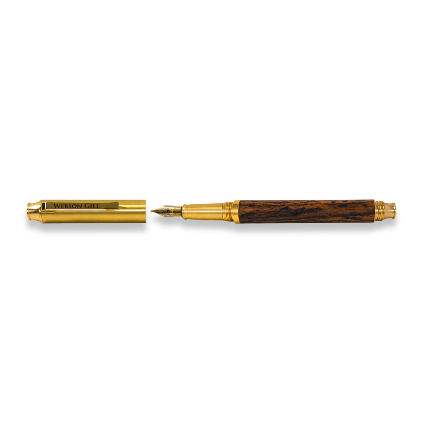 The Webson Gill Prestige Edition Fountain Pen, featuring gold and wood brass accents with an iridium nib and cap off, is displayed on a white background.