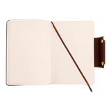 The Webson Gill Leather Writing Notebook features a blank, brown leather cover and a ribbon bookmark, displayed on a white background.