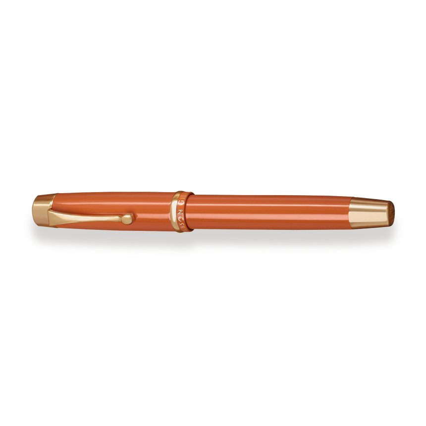 The Muse Fountain Pen by Webson Gill, in orange and gold with cap on and a gold-plated nib, is displayed horizontally on a white background.