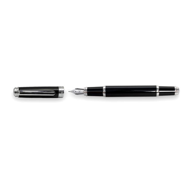 The Mogul Fountain Pen by Webson Gill features a glossy black resin finish with silver accents, shown uncapped and lying horizontally with the cap on the left; its stainless steel nib is visible.
