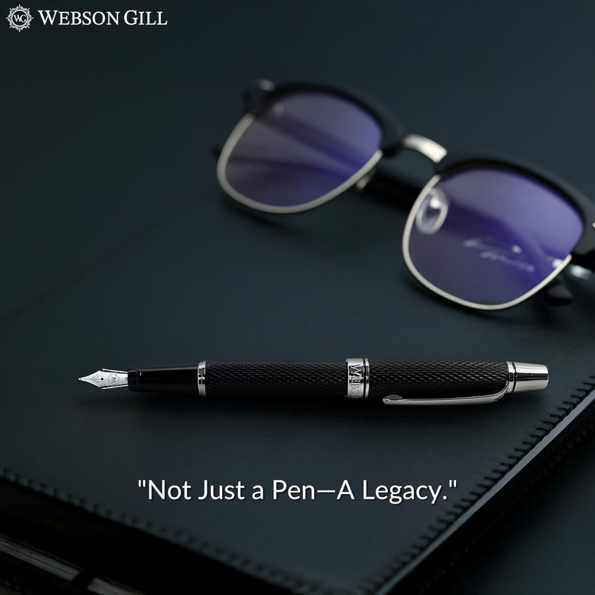 The WG 'Show Up' Everyday Fountain Pen with a stainless steel medium nib and sunglasses rest on a black leather notebook, featuring the text: "Not Just a Pen—A Legacy.