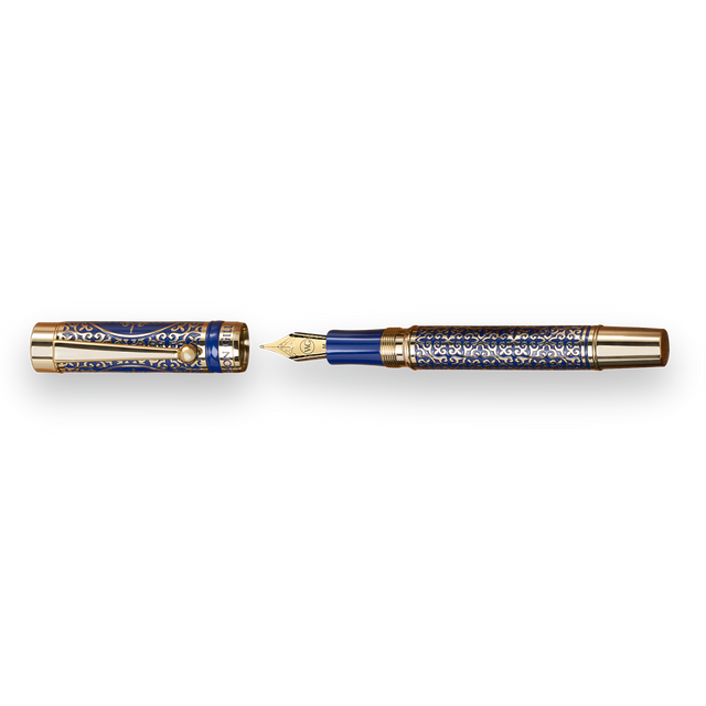 The Regal Fountain Pen by Webson Gill features ornate blue and gold brass filigree. Shown uncapped beside its cap, this luxury pen is a collector’s essential.