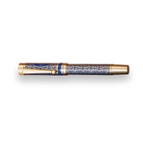 The Regal Fountain Pen by Webson Gill features a gold and blue design, gold brass filigree, and intricate patterns on the barrel and cap—an exquisite choice for fountain pen collectors.
