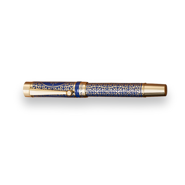 The Regal Fountain Pen by Webson Gill features a gold and blue design, gold brass filigree, and intricate patterns on the barrel and cap—an exquisite choice for fountain pen collectors.